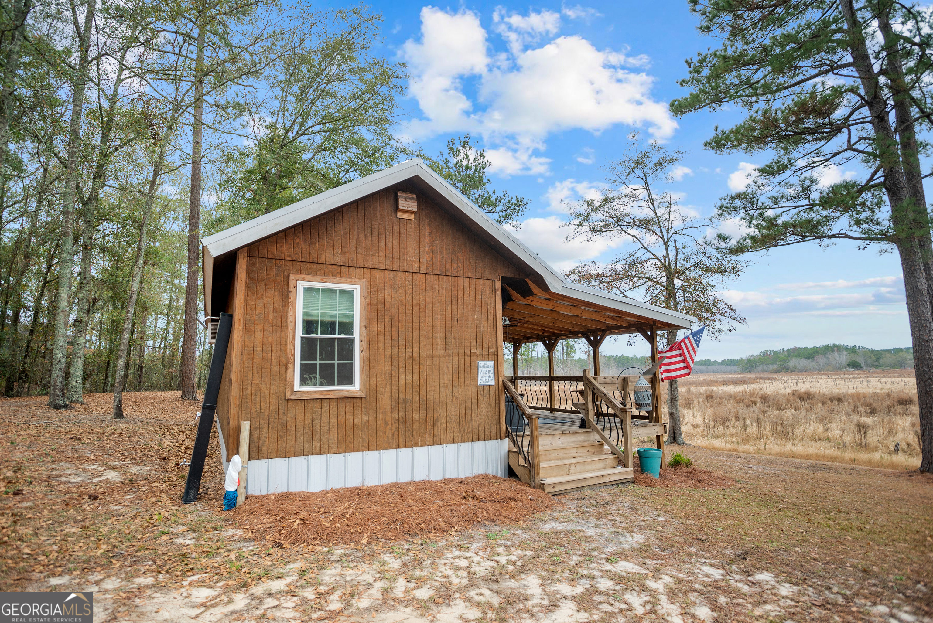 418 Oglesby Pond Road Portal, GA 30450 - Photo 37 of 56 a view of a house with a yard