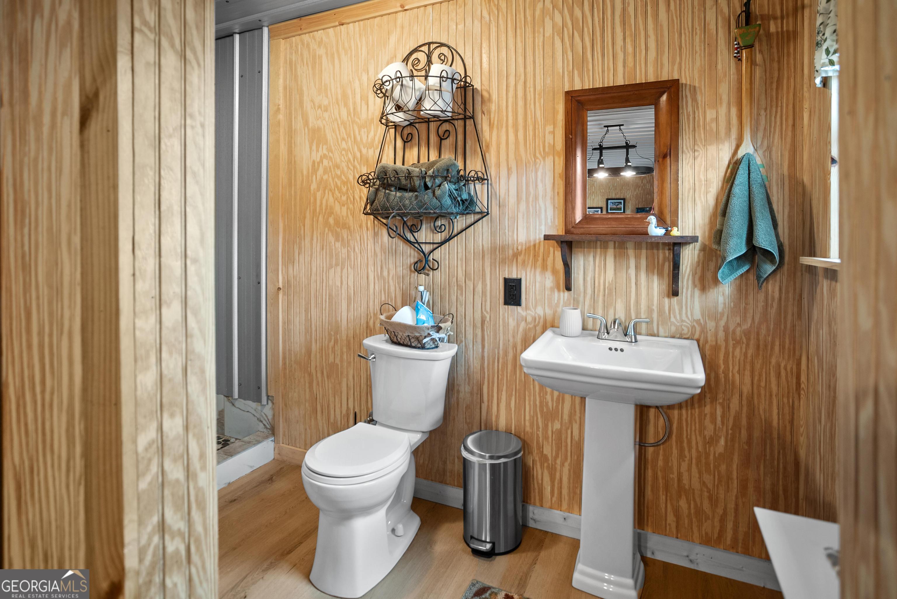 418 Oglesby Pond Road Portal, GA 30450 - Photo 43 of 56 a bathroom with a toilet sink and mirror