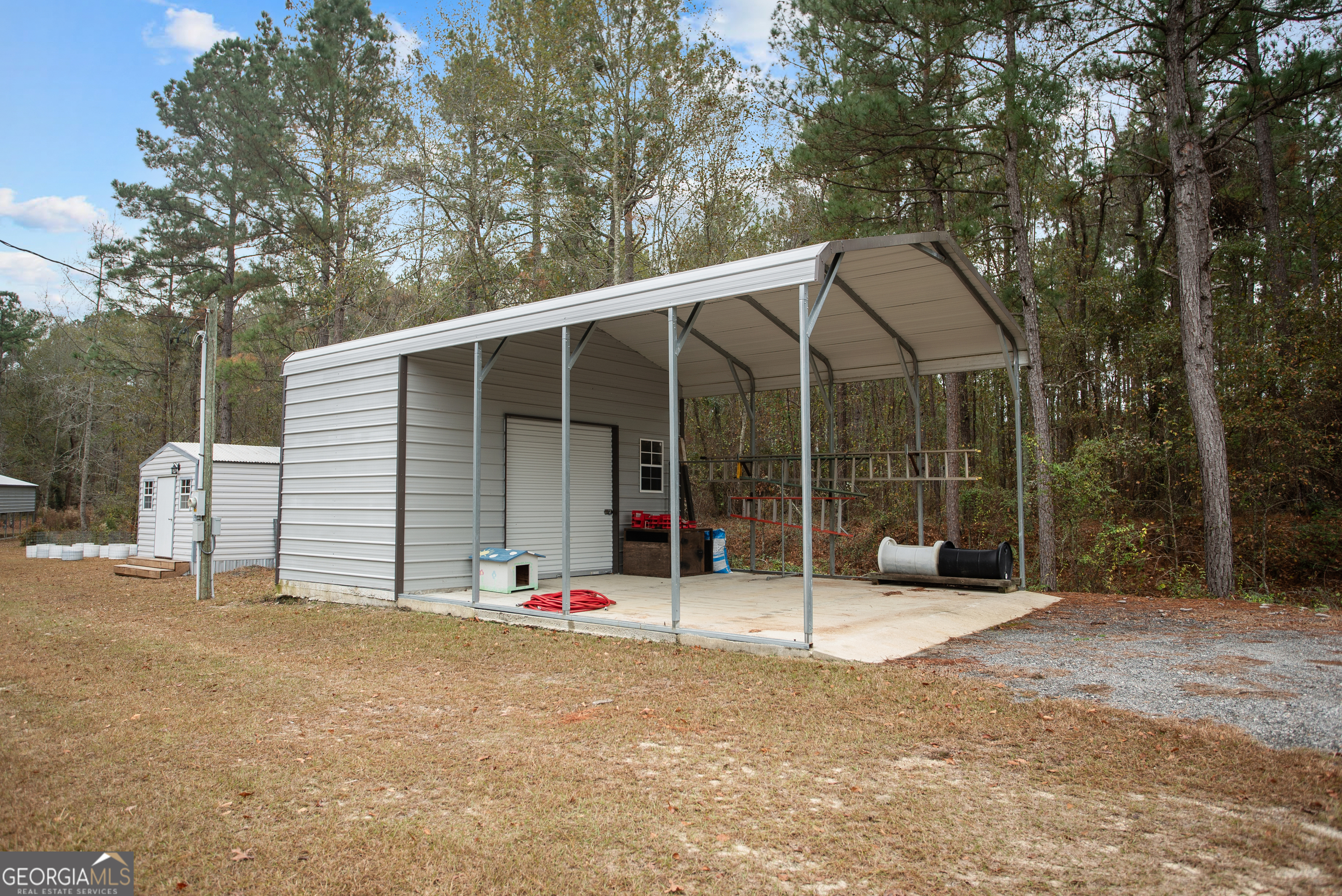 418 Oglesby Pond Road Portal, GA 30450 - Photo 50 of 56 a view of a house with backyard and deck