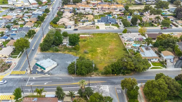 a house with a big yard and large trees