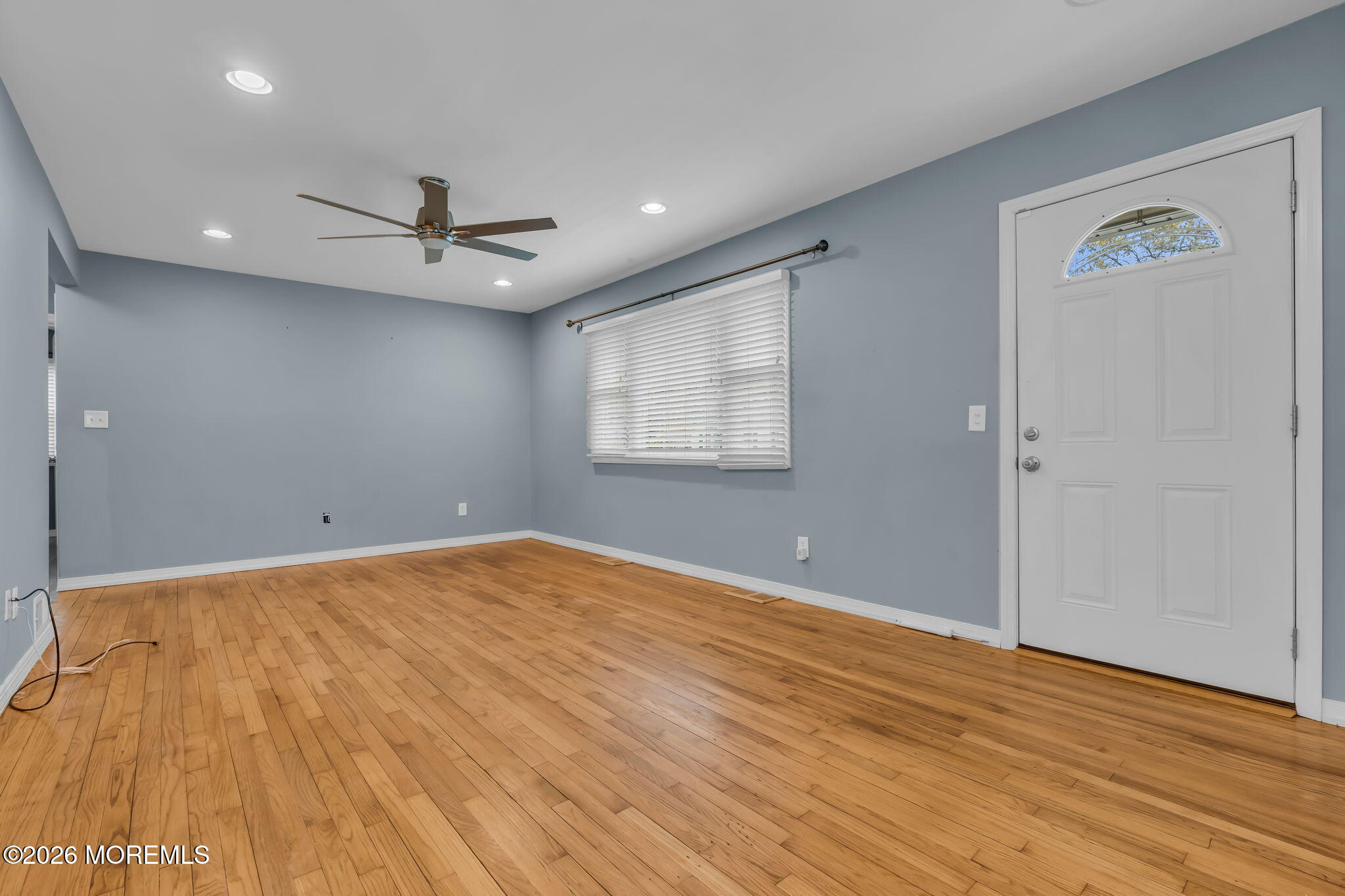 593 Beach Plum Road Brick, NJ 08723 - Photo 9 of 38 wooden floor in an empty room with a window