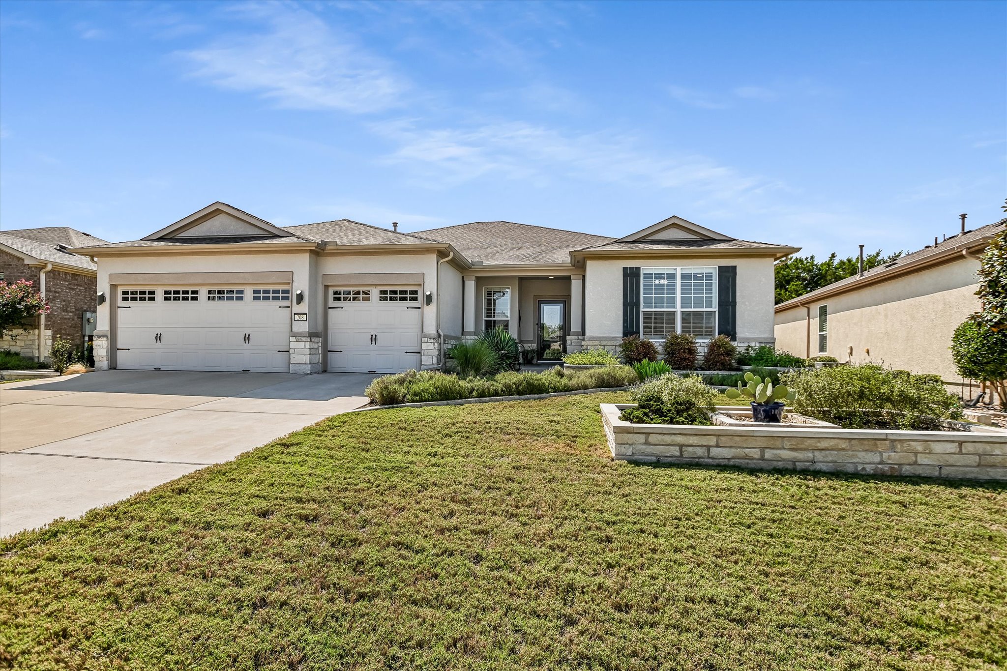 208 McKittrick Ridge Road Georgetown, TX 78633 - Photo 1 of 1 a front view of a house with a garden