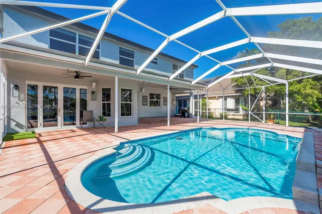 a view of swimming pool with outdoor seating
