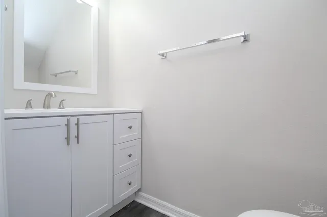 a bathroom with a sink and mirror