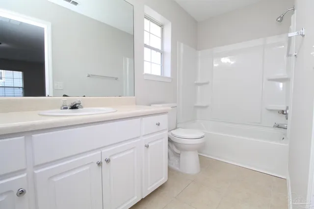 a bathroom with a sink a toilet and a bathtub