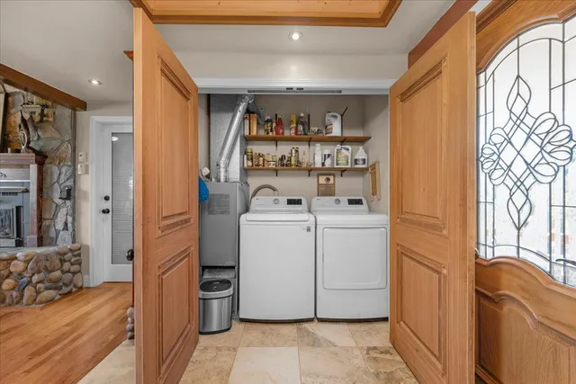 a spacious bathroom with a tub sink and mirror
