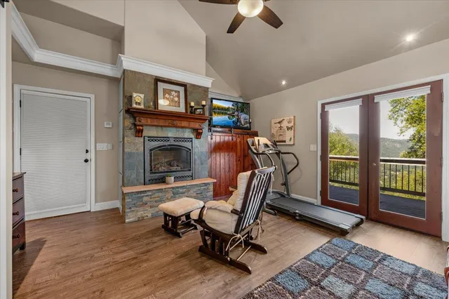 a view of a hallway with bathroom and a livingroom
