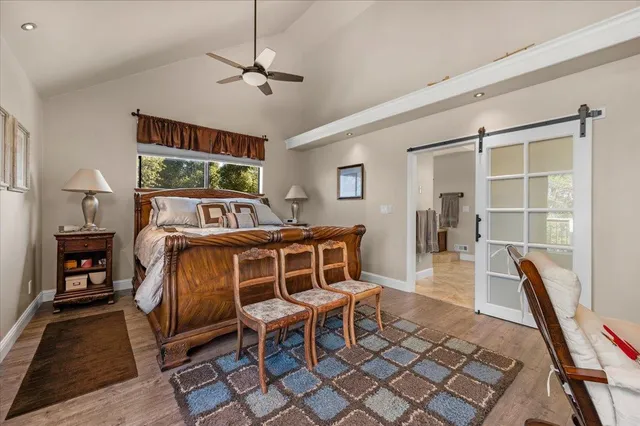 a view of a utility room with a sink and a window