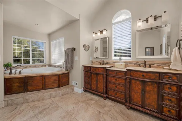 a view of a balcony with wooden floor and fence
