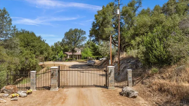 a front view of a house with a yard and balcony