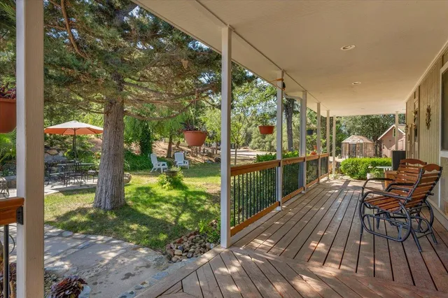 a living room with fireplace furniture and a wooden floor
