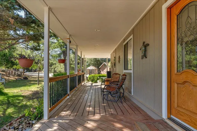 a living room with furniture a fireplace and a table