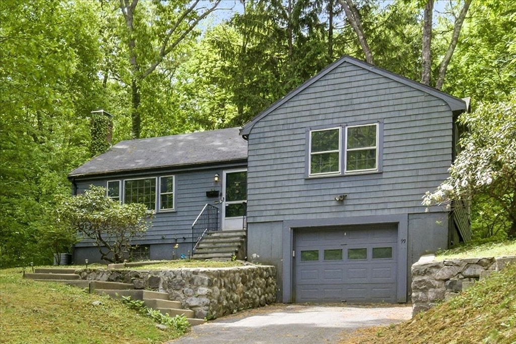 99 Brook Road Sharon, MA 02067 - Photo 33 of 37 a front view of a house with garage