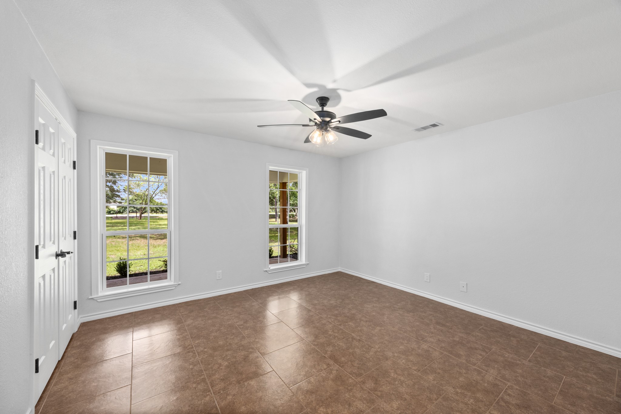 10209 Oberrender Road Needville, TX 77461 - Photo 25 of 50 1st Secondary Bedroom offers tons of space, lots of light, brand new windows and good size closet.