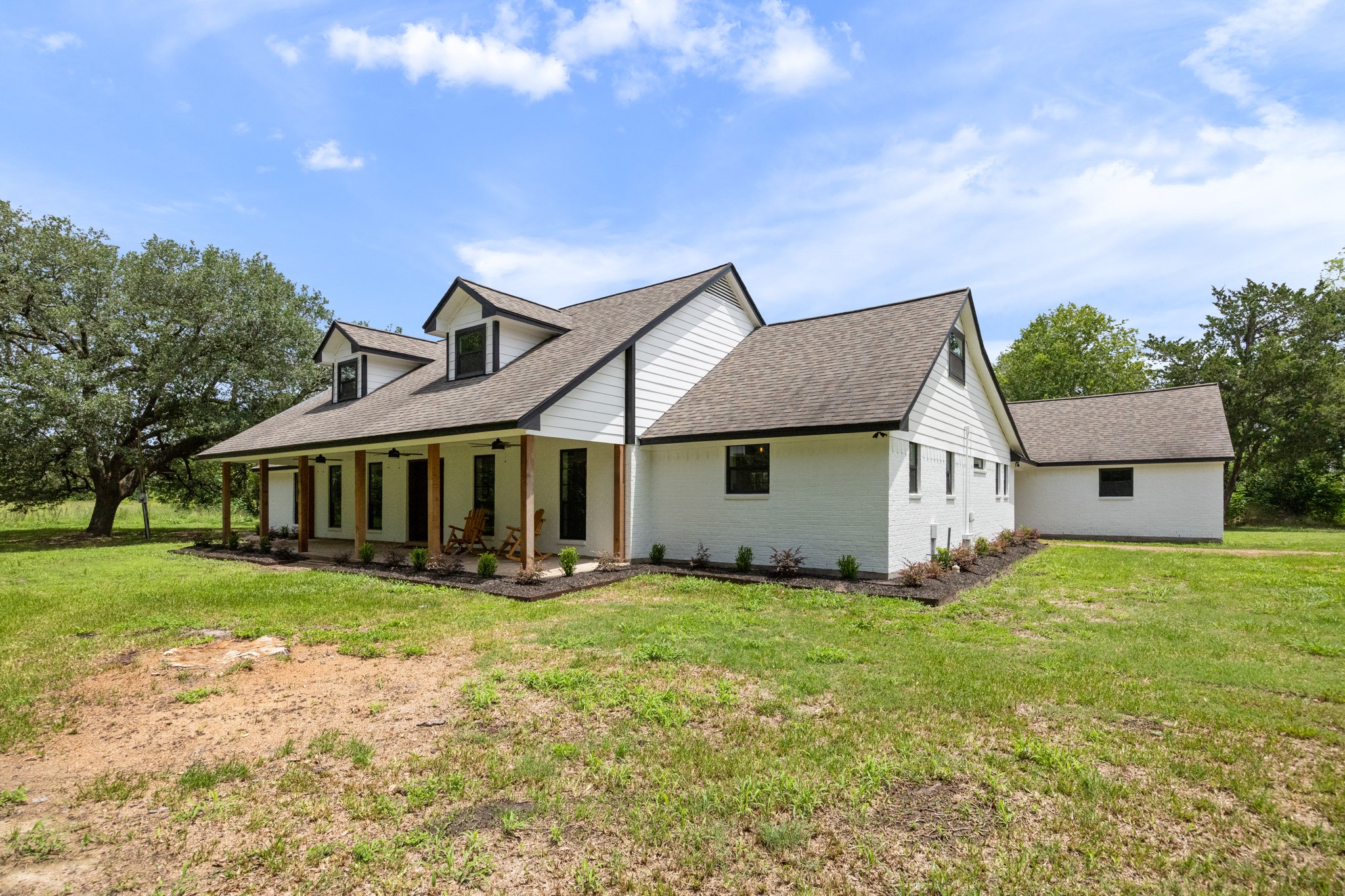 10209 Oberrender Road Needville, TX 77461 - Photo 8 of 50 Great view of the striking freshly painted exterior of the home, and detached 2 car garage.