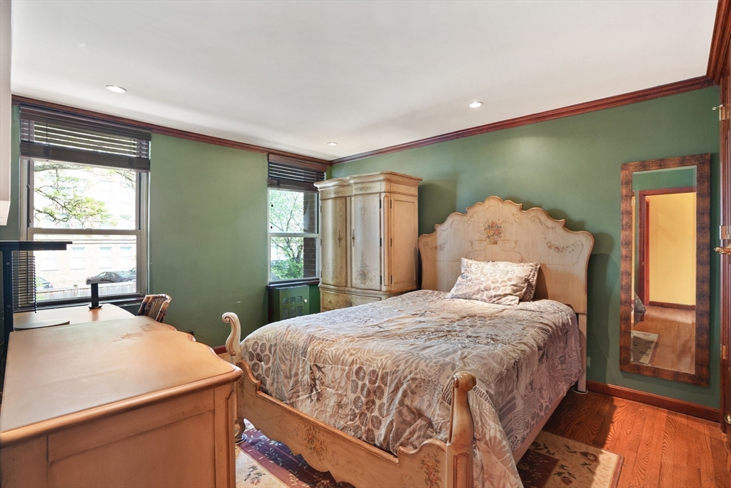 131 Perkins Street, Unit 131 Boston, MA 02130 - Photo 12 of 21 a bedroom with a large bed and a window