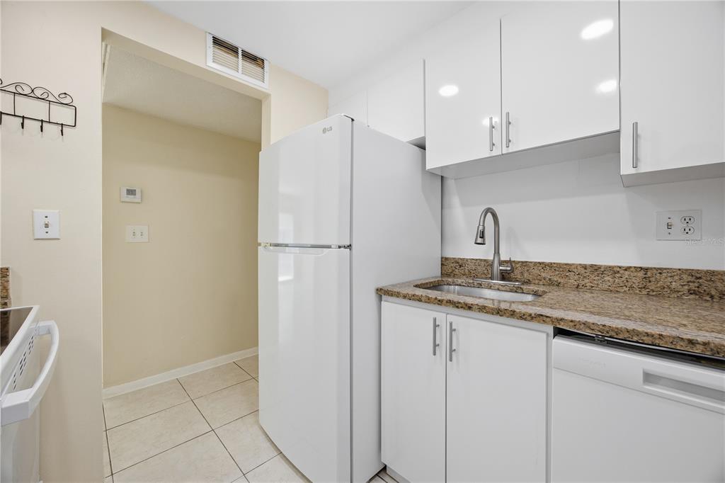 925 West Oak Ridge Road, Unit 925C Orlando, FL 32809 - Photo 6 of 15 a kitchen with appliances a sink and cabinets