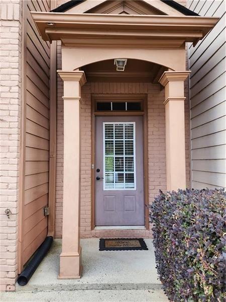 5079 Sherwood Way Cumming, GA 30040 - Photo 3 of 14 a view of entrance door of the house