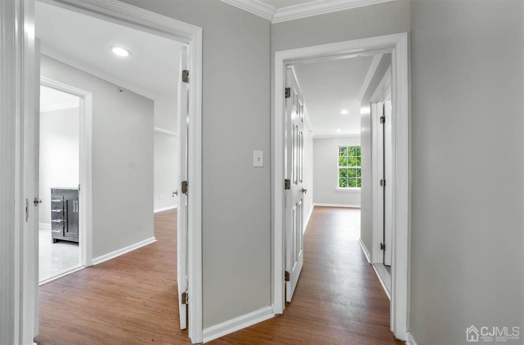 261 Prestwick Way Edison, NJ 08820 - Photo 17 of 25 a view of a hallway with wooden floor