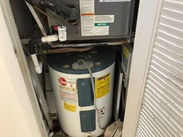 a kitchen with granite countertop a sink and a stove