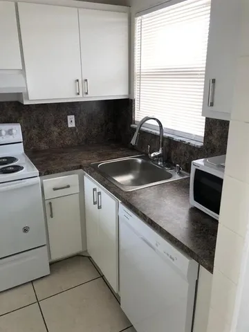 a view of a living room with windows