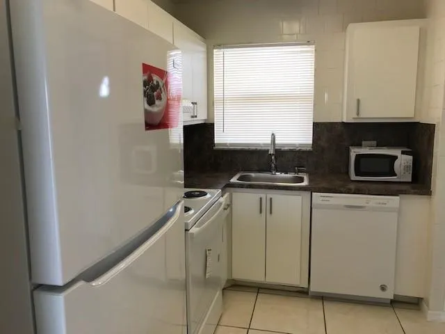 a room with cabinets and a window