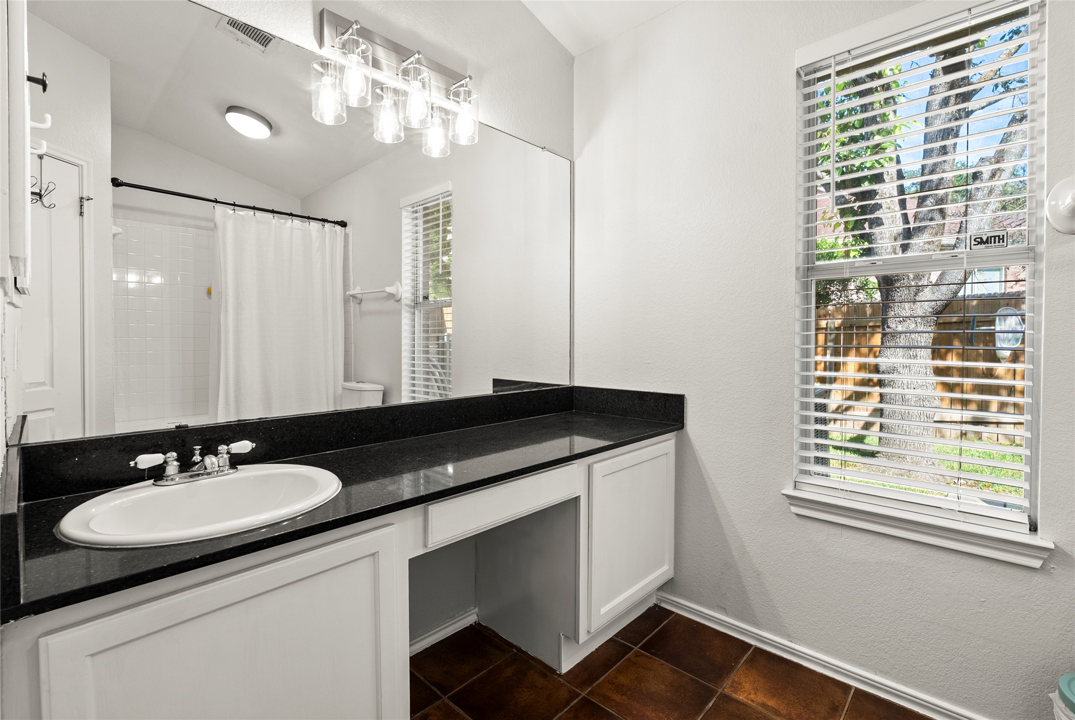 9024 Heiden Lane Austin, TX 78749 - Photo 20 of 33 The private primary bathroom features an oversized single vanity with generous countertop space, making your morning routine feel organized