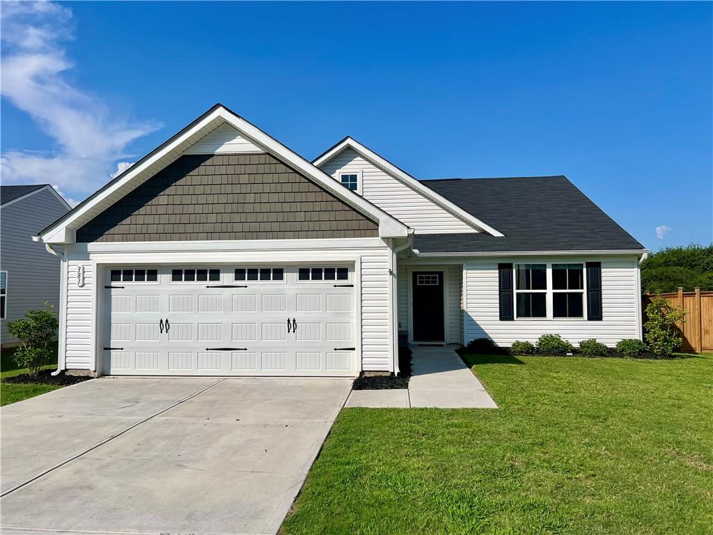 381 Cartecay Drive Calhoun, GA 30701 - Photo 1 of 1 a front view of a house with a yard