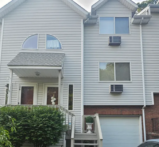 a front view of a house with balcony