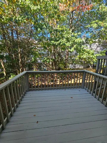 a view of deck with wooden floor and fence
