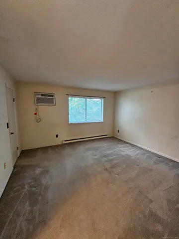 an empty room with a empty space and windows