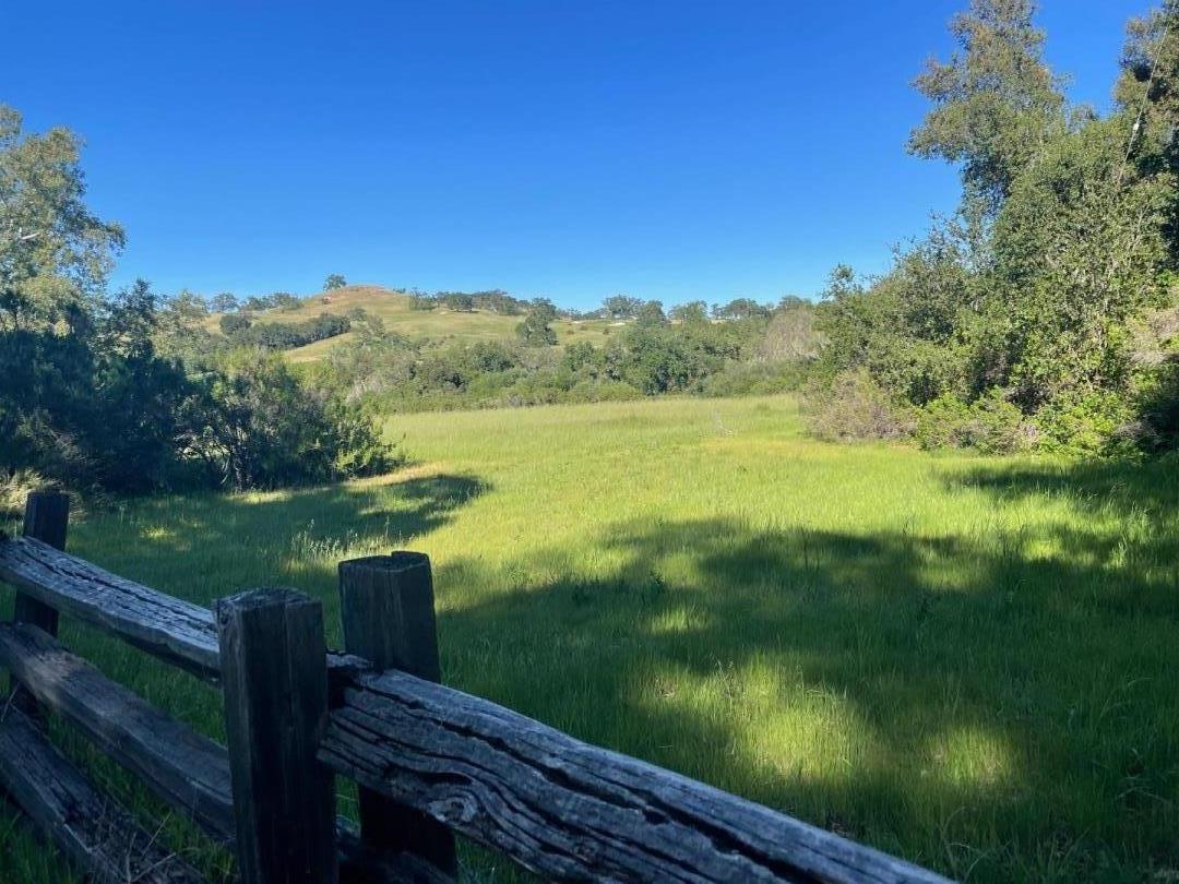 34222 Robinson Canyon Road Carmel, CA 93923 - Photo 1 of 7 a view of a lake with a yard