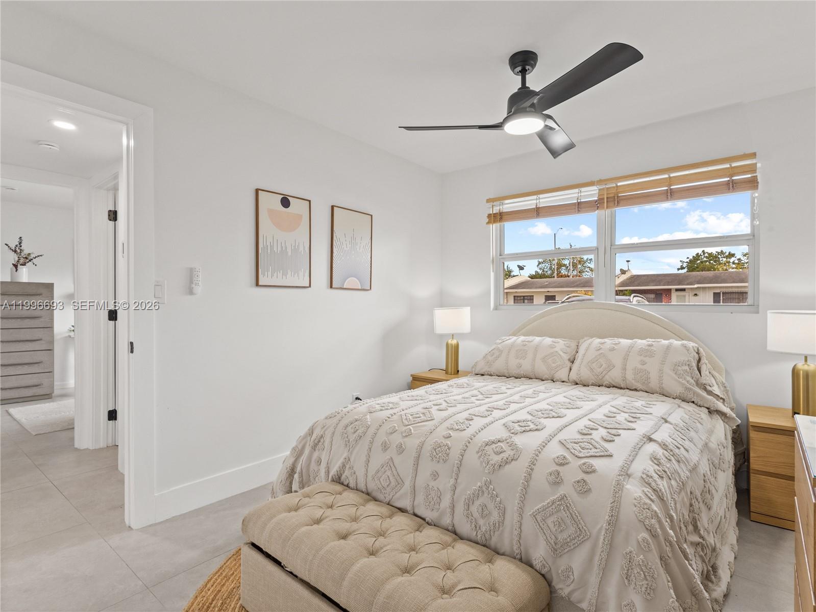 10017 Southwest 23rd Terrace Miami, FL 33165 - Photo 16 of 25 a bedroom with a bed and window
