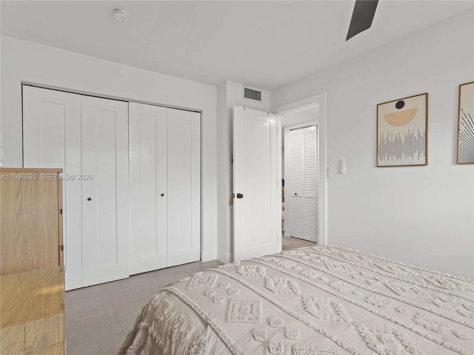 10017 Southwest 23rd Terrace Miami, FL 33165 - Photo 18 of 25 a bedroom with a bed and a shower