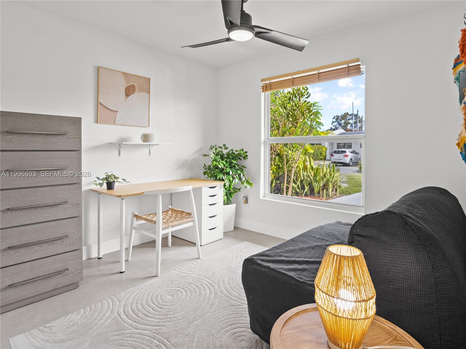 10017 Southwest 23rd Terrace Miami, FL 33165 - Photo 19 of 25 a living room with furniture and a large window