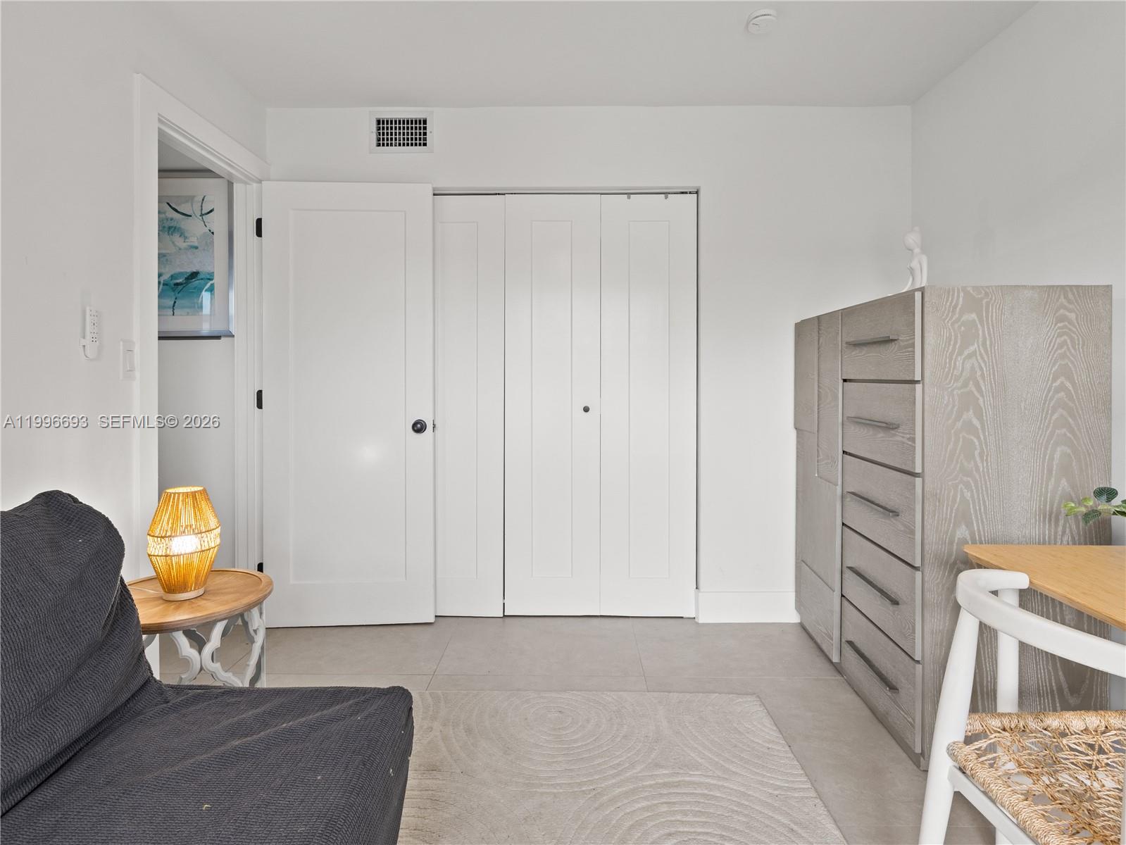 10017 Southwest 23rd Terrace Miami, FL 33165 - Photo 20 of 25 a living room with furniture and a baby crib