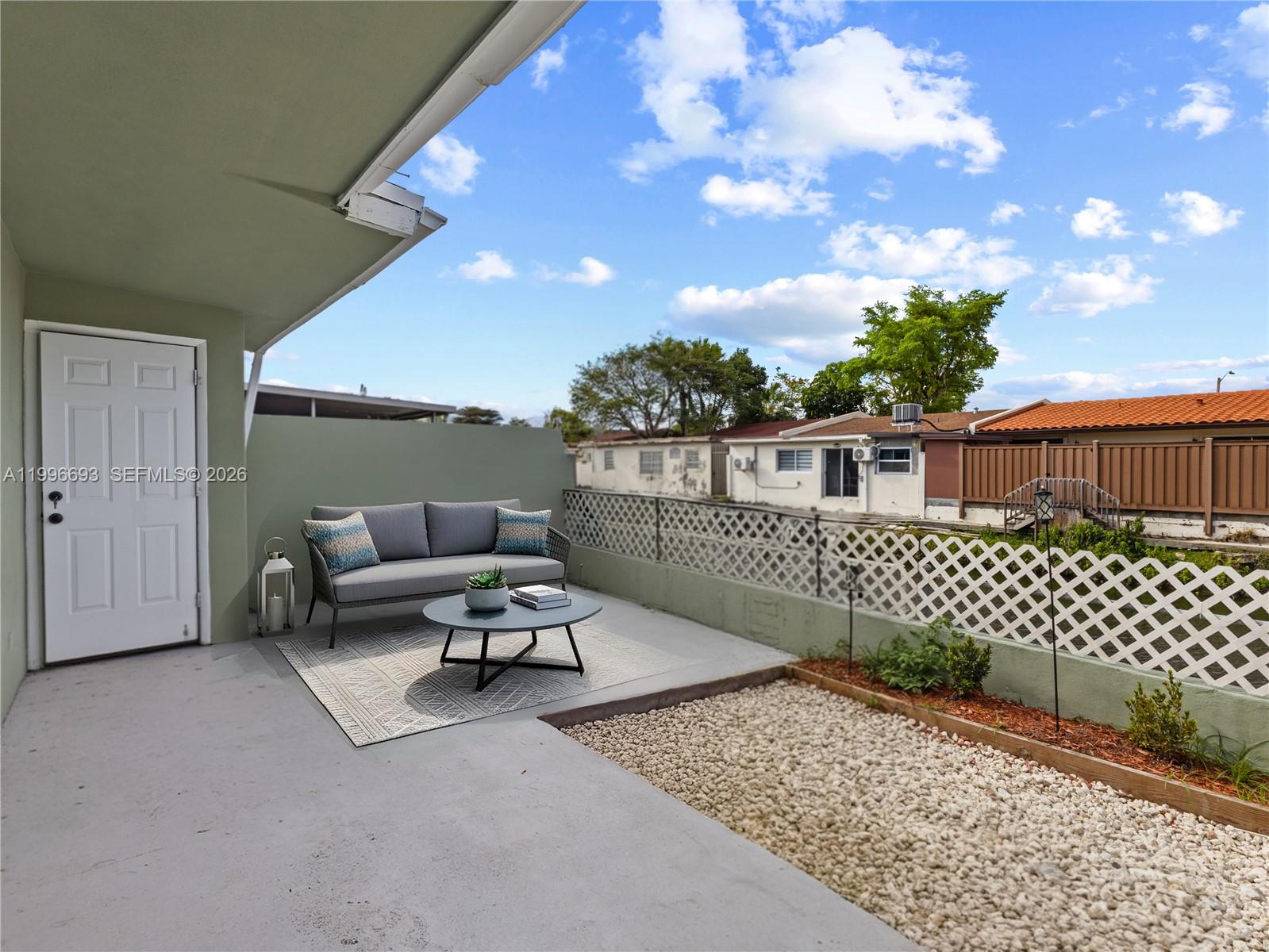 10017 Southwest 23rd Terrace Miami, FL 33165 - Photo 22 of 25 a roof deck with a couch