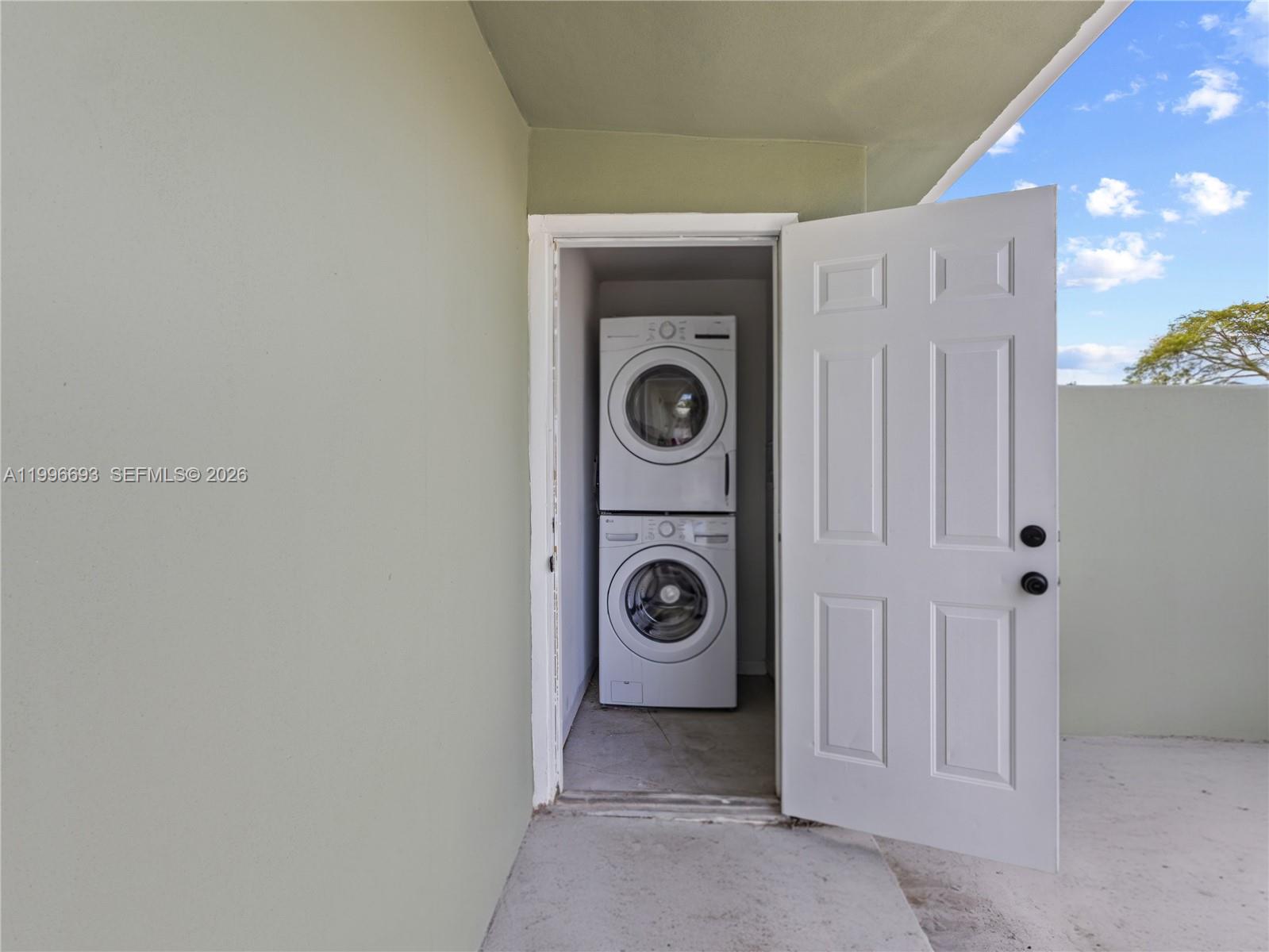 10017 Southwest 23rd Terrace Miami, FL 33165 - Photo 24 of 25 a view of a storage & utility room with washer and dryer