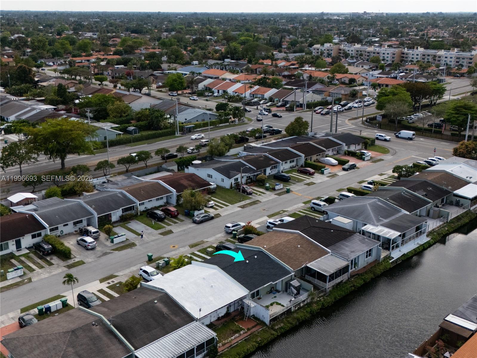 10017 Southwest 23rd Terrace Miami, FL 33165 - Photo 3 of 25 an aerial view of a city with lots of residential buildings