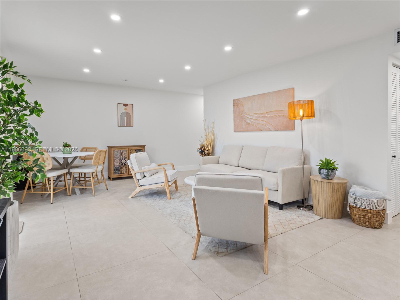 10017 Southwest 23rd Terrace Miami, FL 33165 - Photo 9 of 25 a living room with furniture and a potted plant