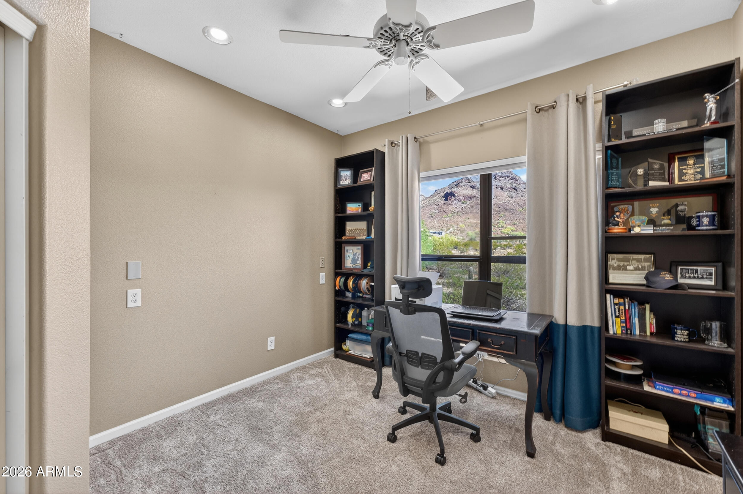 1539 East Winged Foot Road Phoenix, AZ 85022 - Photo 43 of 64 a view of a workspace with furniture and a window