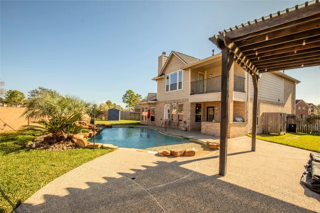 a view of swimming pool with outdoor seating