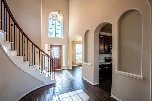 a kitchen with stainless steel appliances granite countertop a stove a refrigerator and a sink