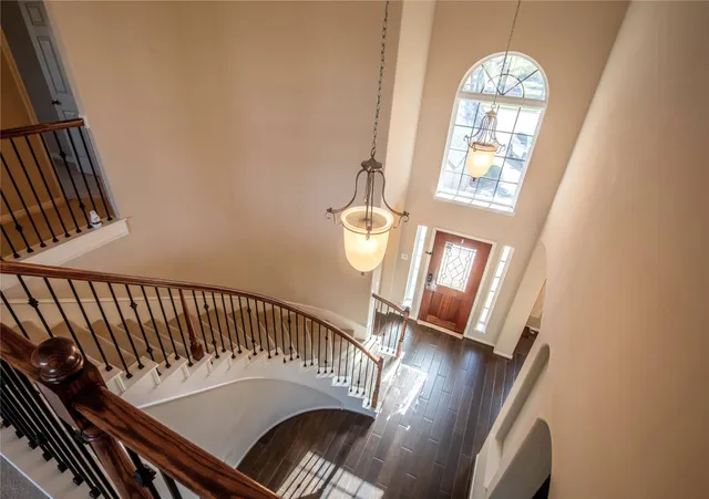 a kitchen with stainless steel appliances kitchen island granite countertop a sink refrigerator and cabinets