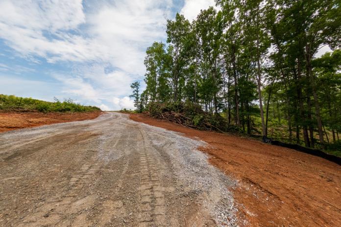 4 Warpath Ridge Trail Six Mile, SC 29682 - Photo 12 of 16 Gravel road winds through a cleared lot, ready for development.