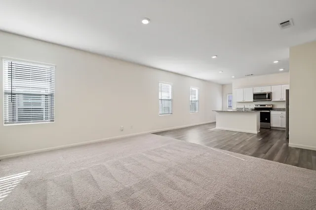a view of kitchen and wooden floor