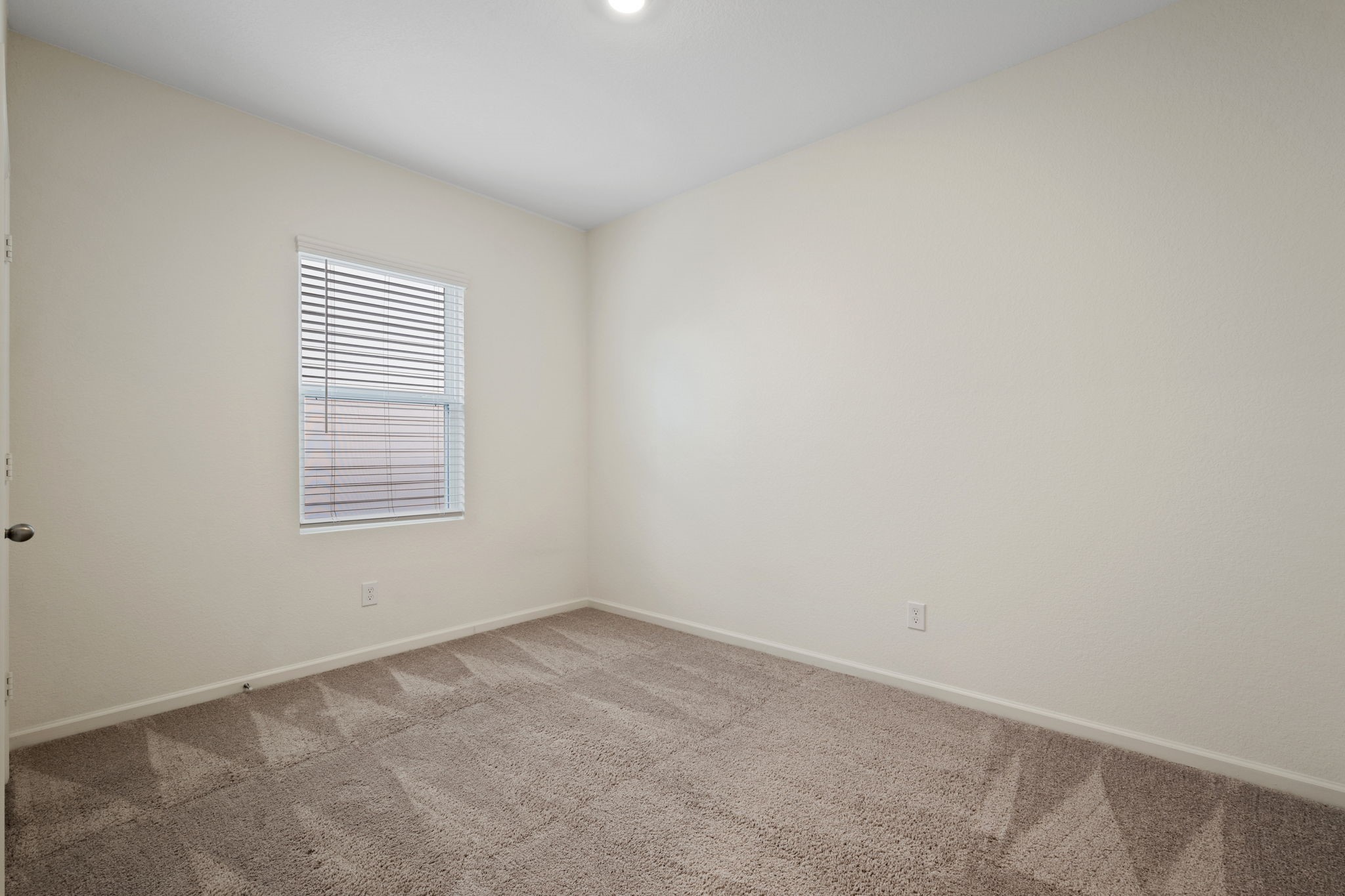 614 Edge Lake Court Montgomery, TX 77316 - Photo 17 of 27 an empty room with a window