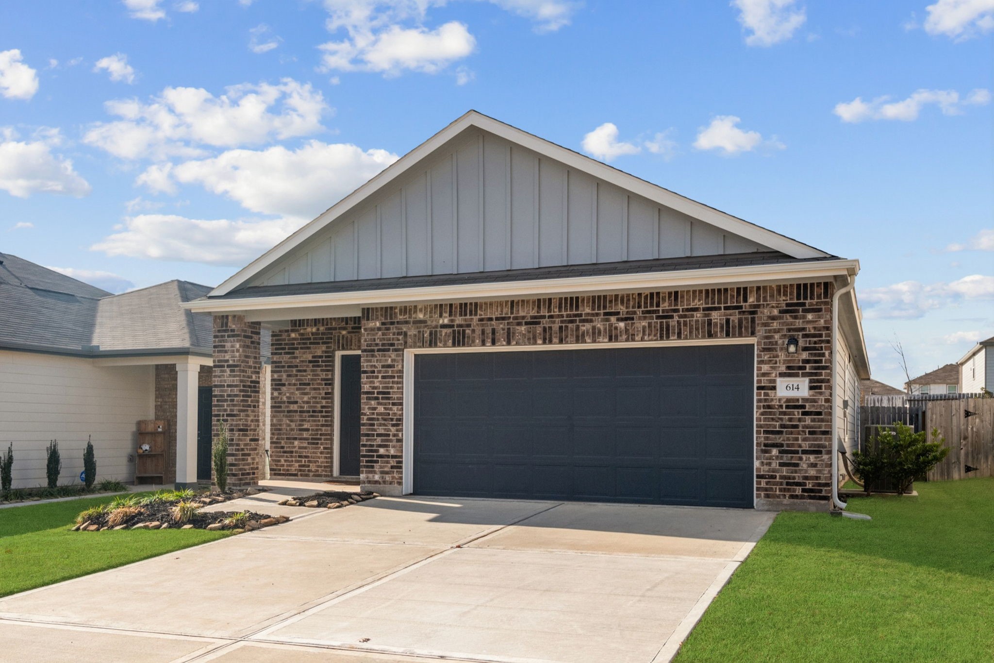 614 Edge Lake Court Montgomery, TX 77316 - Photo 2 of 27 a front view of a house with a yard and garage