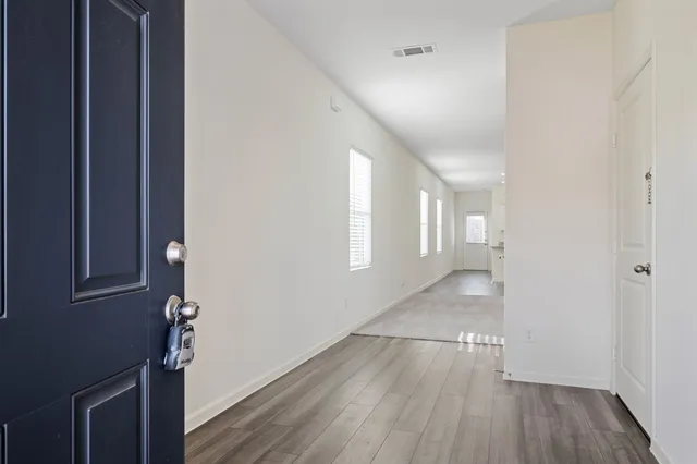 a view of livingroom with hardwood floor and hallway