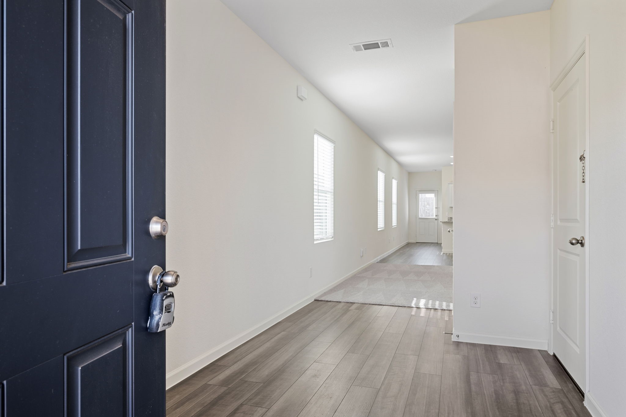 614 Edge Lake Court Montgomery, TX 77316 - Photo 3 of 27 a view of livingroom with hardwood floor and hallway
